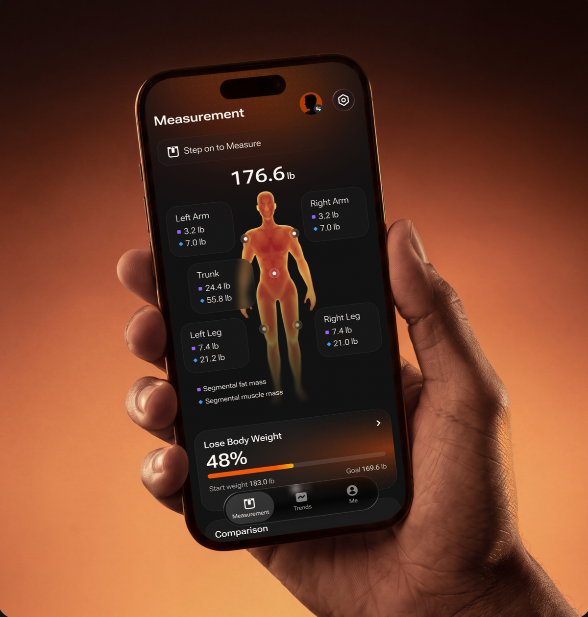 Hand holding a phone with the Fitindex segmental measurement screen